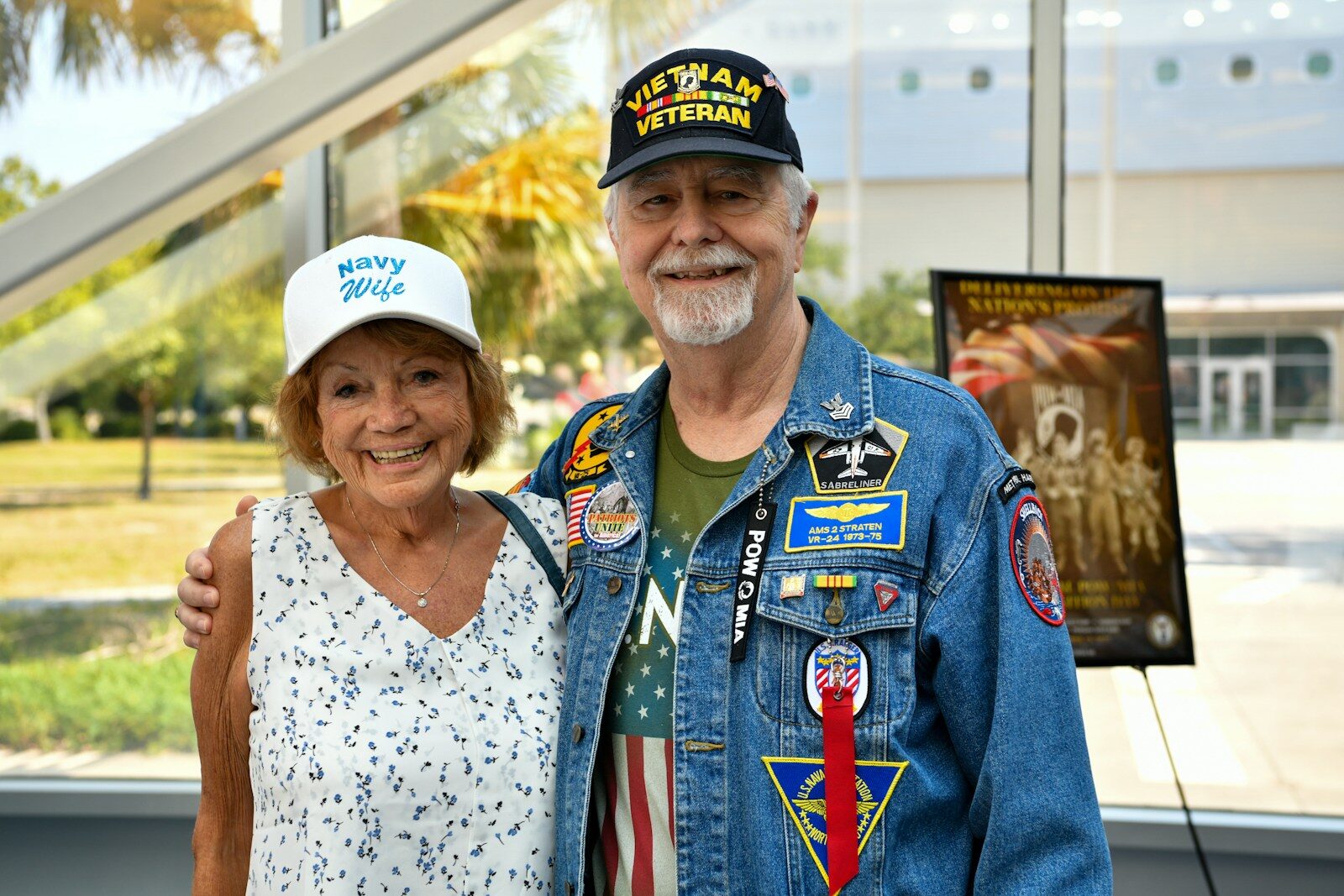 Couple wearing veteran hats and patches